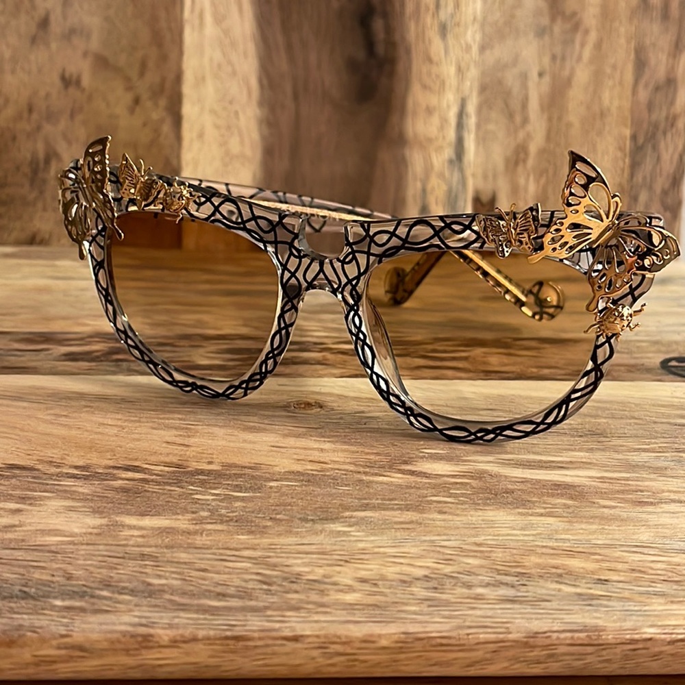 Anna-Karin Karlsson gold butterfly gradient sunglasses.